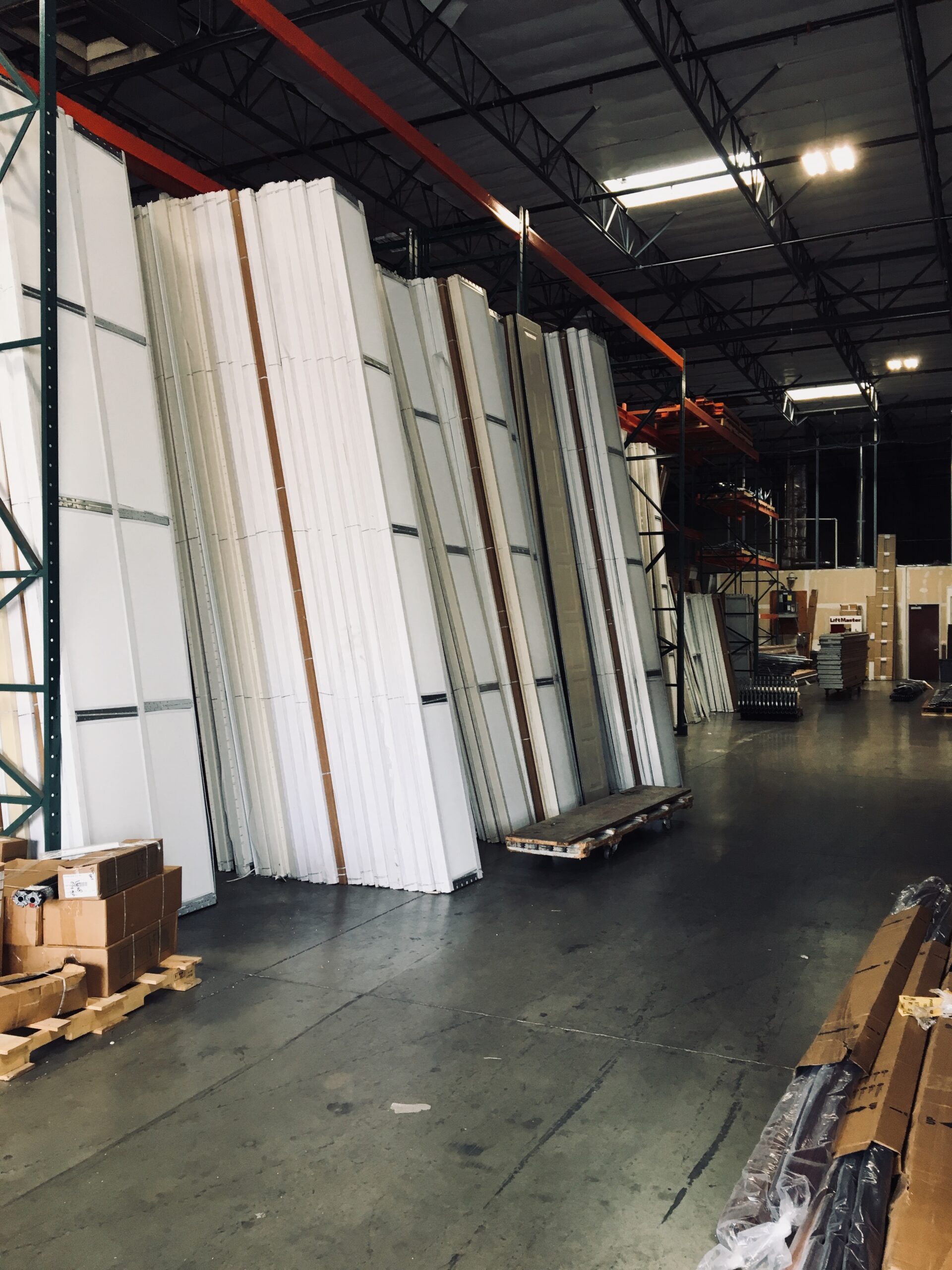 Large inventory of premium residential and commercial garage doors ready for installation in Phoenix, AZ.