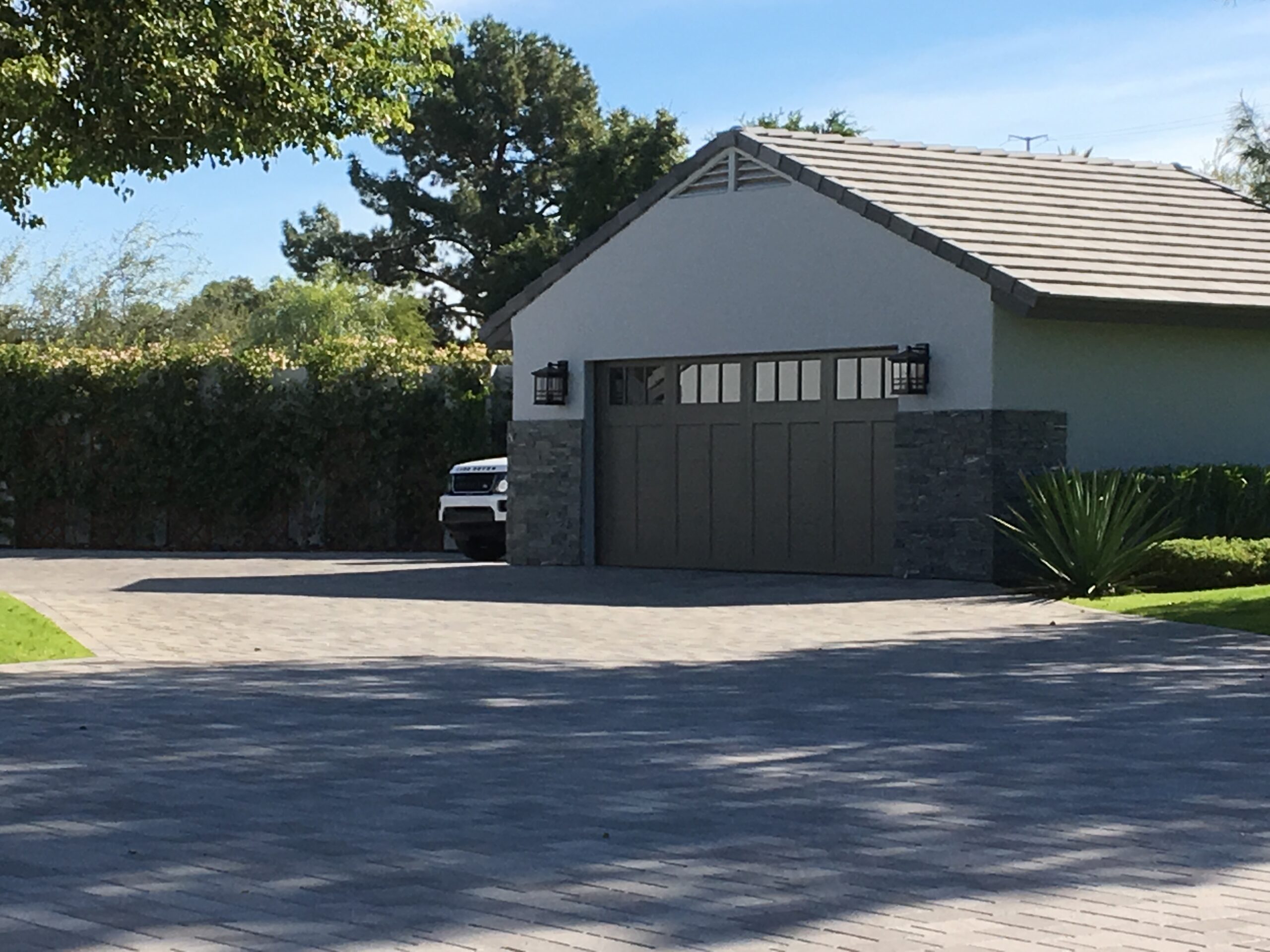 Elegant custom garage door installation designed to enhance curb appeal, security, and modern Arizona home style.