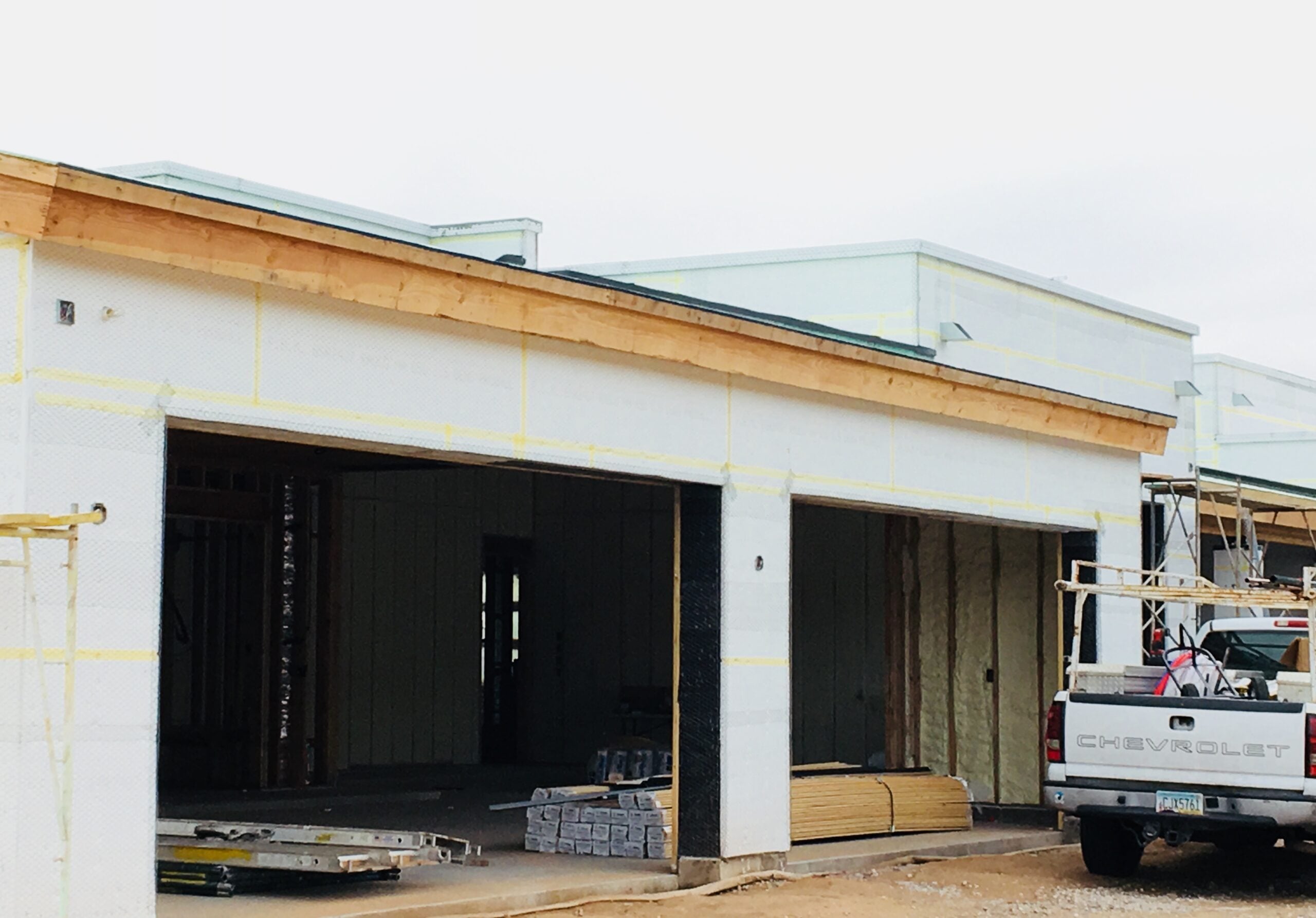 New construction garage door installation in Phoenix AZ featuring custom oversized garage openings, insulated overhead doors, and professional residential garage build services.